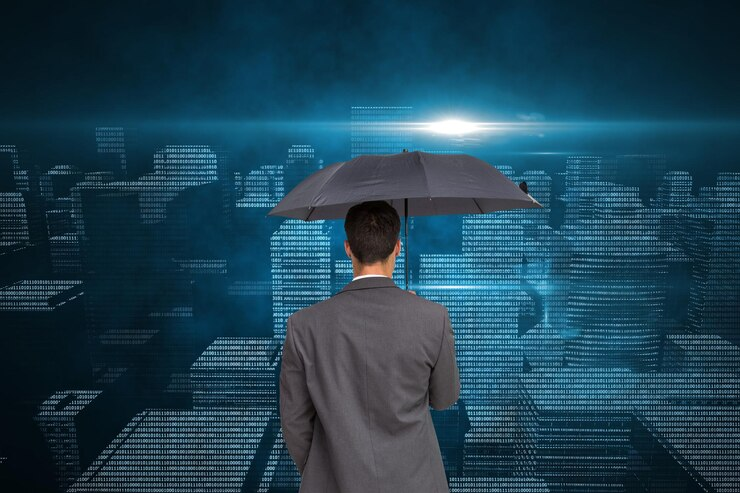 Insurance professionals collaborating on laptops with UI diagrams, representing building full-scale software with no code in the insurance industry.