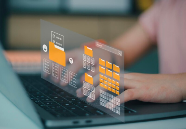 a person typing on a laptop