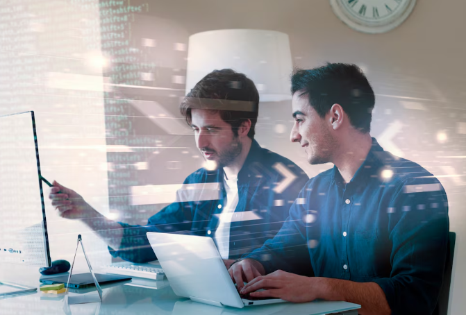 Two people working on computers.