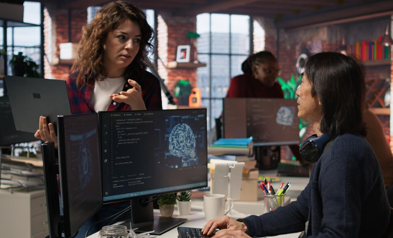 Two people collaborating in an office.
