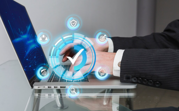 Businessman using laptop with icons