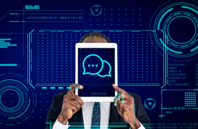 Person holding tablet with chat icon