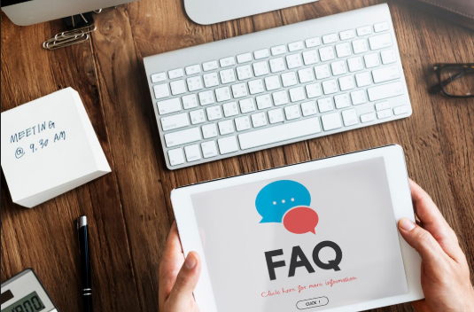 Tablet displaying FAQ on desk