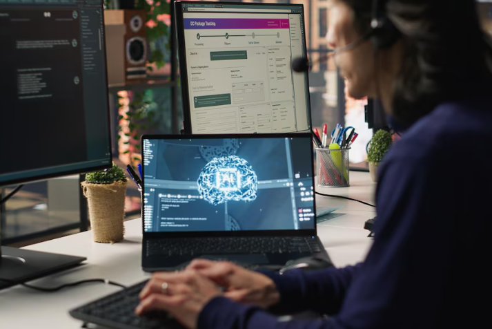 Developer at workstation coding AI project with neural network graphics.