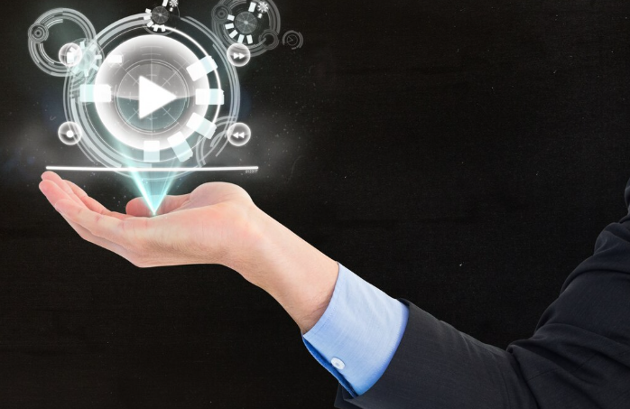 Businessman holding futuristic hologram play button with digital interface icons and AI Video Generation.