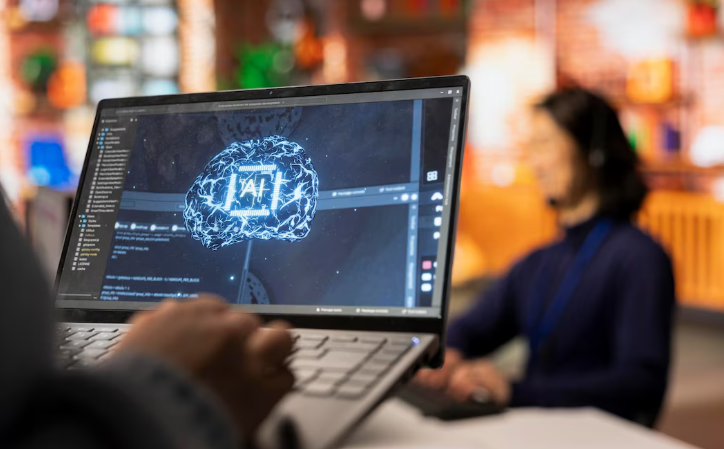Close-up of laptop showing artificial intelligence brain graphic in workspace.
