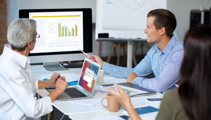 Team discussing data insights during a meeting.