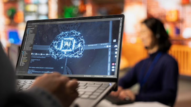 Laptop showing AI brain visualization in progress.