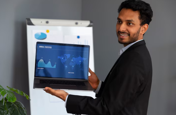 Person presenting annual statistics on laptop.