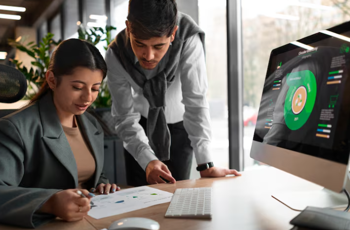 two peoples talking about on computer screen on crm about