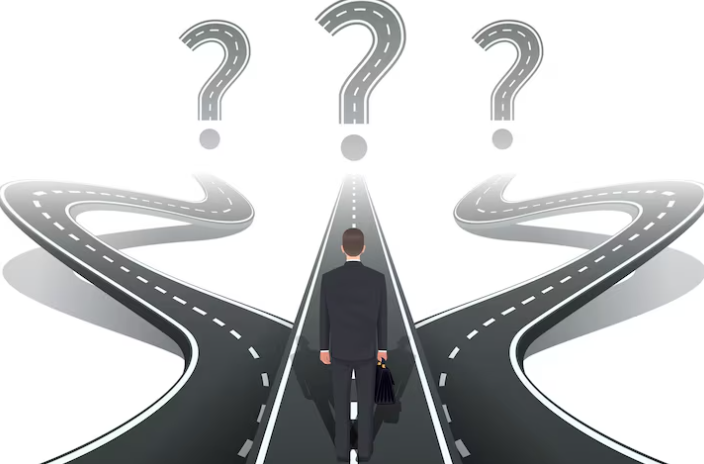 Businessman at crossroads with three paths and question marks