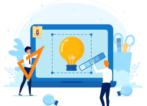 Two people designing a light bulb on giant laptop screen.