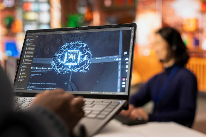 Person using laptop with AI digital brain interface.