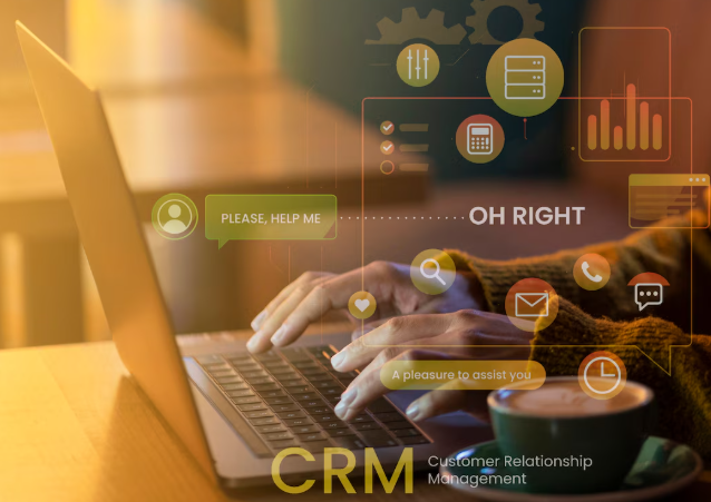 Person typing on laptop with CRM icons and chat bubbles overlay.