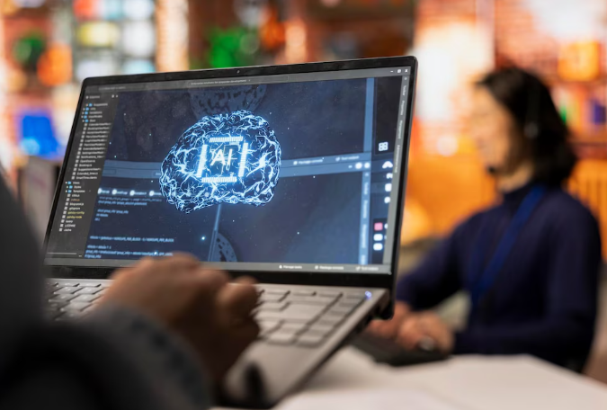 Close-up of laptop screen displaying glowing AI brain design.