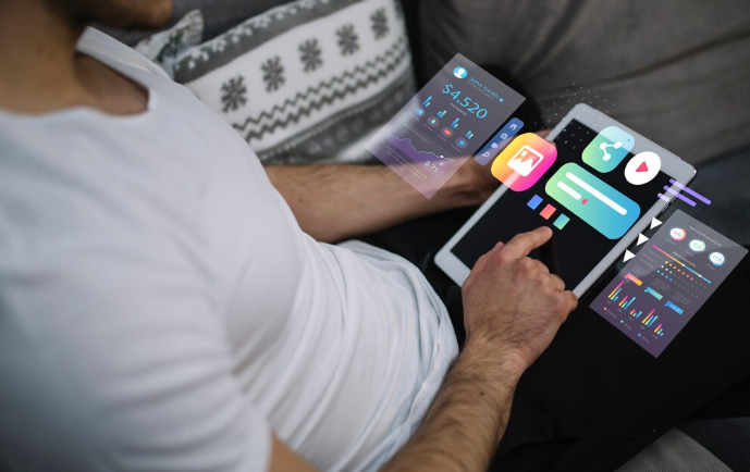 Person operating tablet with floating interactive financial dashboards and apps.