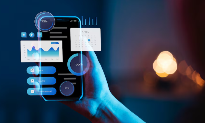 Hand holding phone displaying analytics and calendar dashboard.