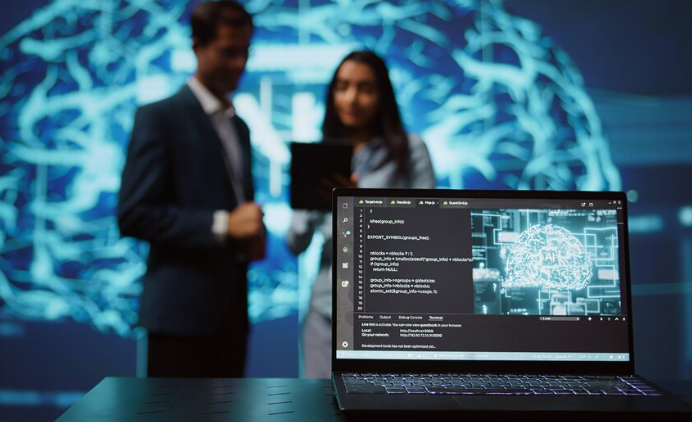 Laptop showing AI programming code with professionals in background.