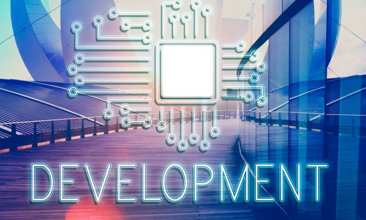 Futuristic circuit microchip design glowing with the word development below.