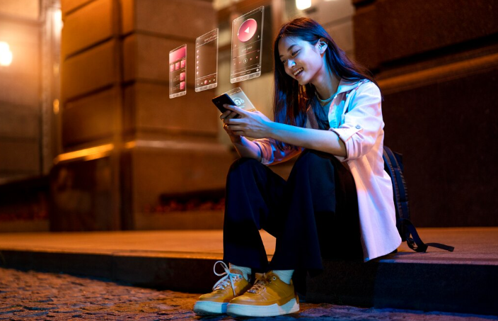 Person using phone at night.
