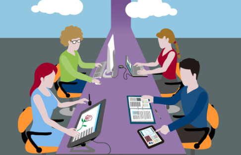 Team of designers collaborating at workstation with digital tools.