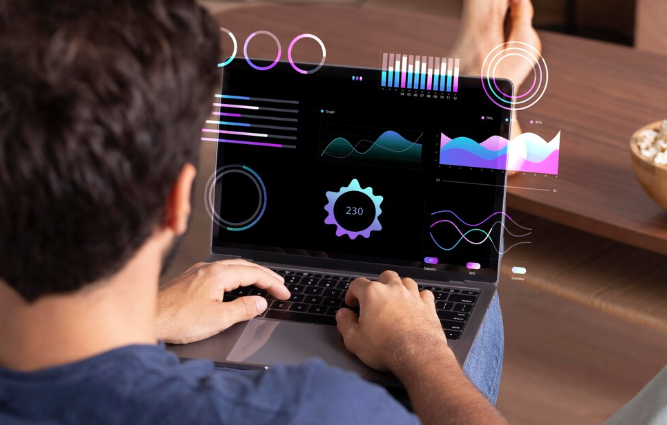 Man reviewing data visualization and analytics on laptop with overlays.