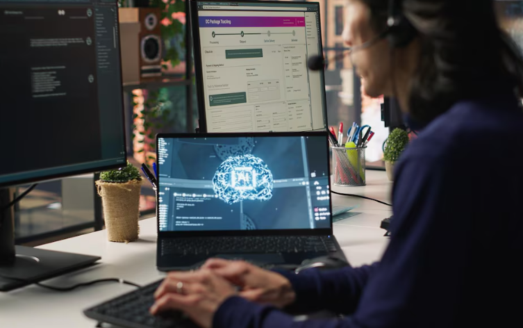 Programmer coding AI system on laptop with brain hologram displayed.