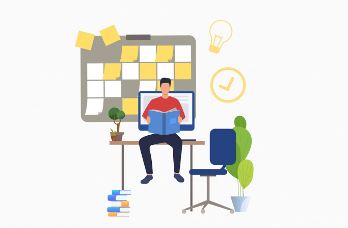 Man studying with sticky notes, computer, books, and desk setup.