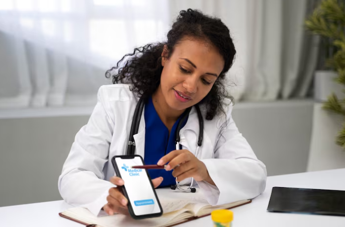 Female doctor showing medical clinic app on smartphone screen.