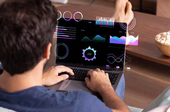 Person analyzing data on laptop