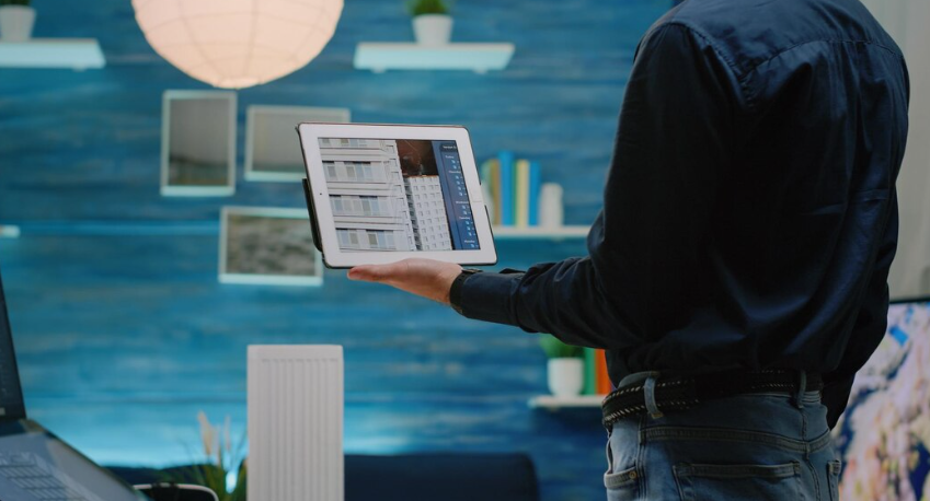Person holding a tablet to analyze and review structured data.